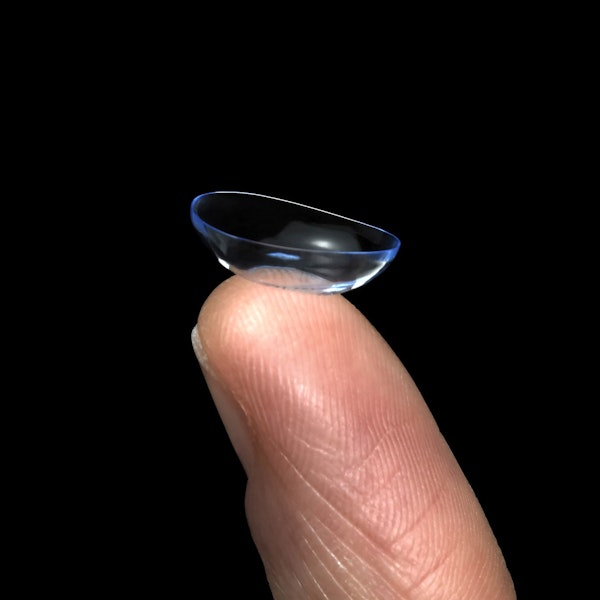 Contact lens on a finger