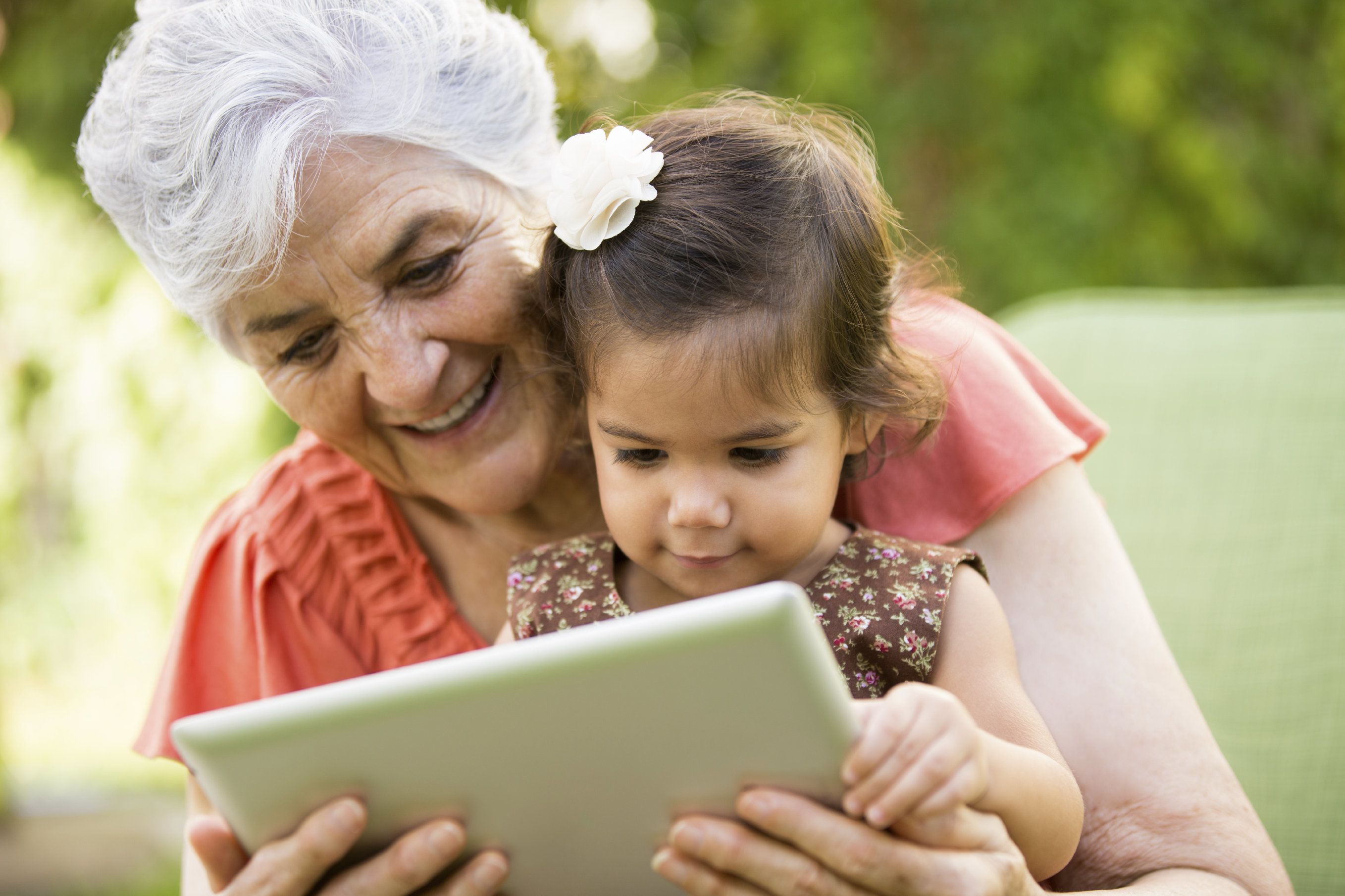 Mature woman reading to a little girl