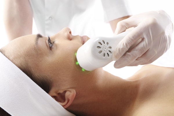 Woman getting microdermabrasion treatment