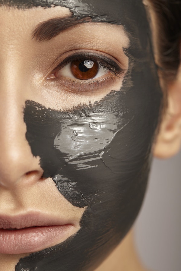 woman wearing mud mask