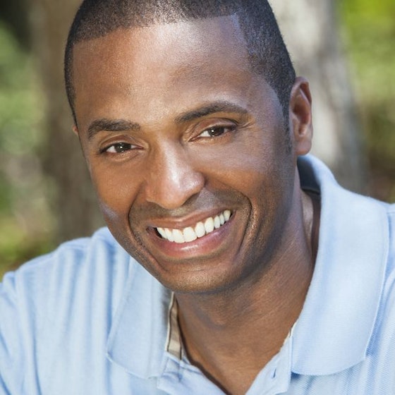 Smiling man in a blue shirt