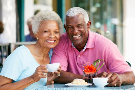 Smiling older couple at a cafe