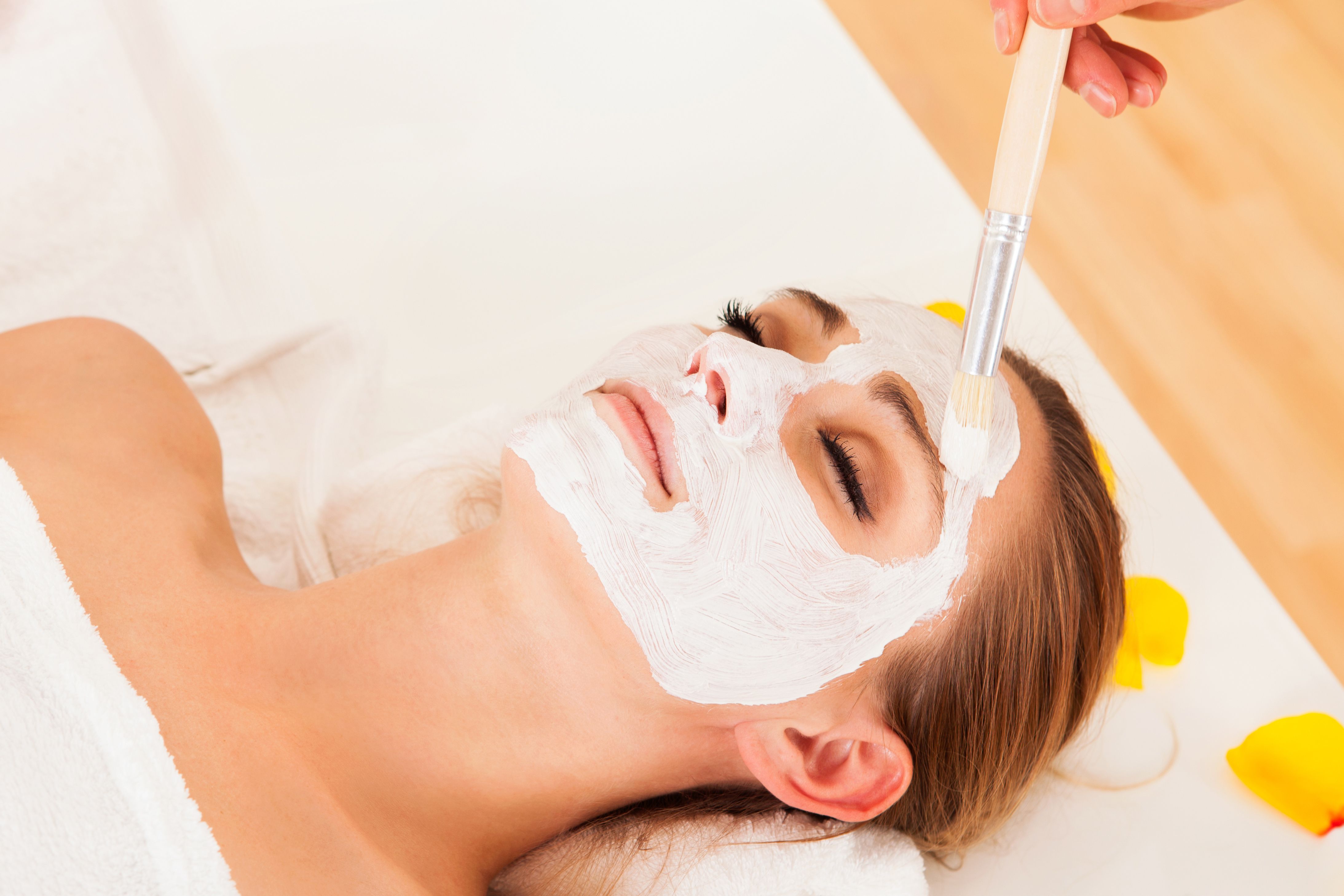 Woman receiving chemical peel treatment