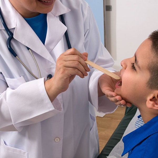 Pediatrician checking on child