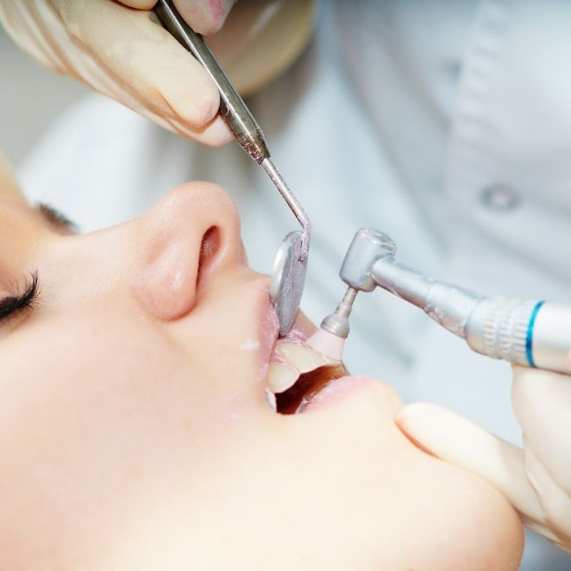 Woman getting her teeth cleaned