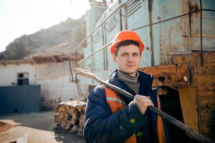An industrial worker in a hard hat