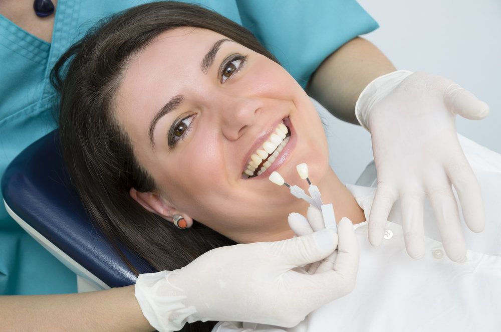 woman getting veneers placed