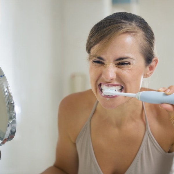 Woman brushing her teeth