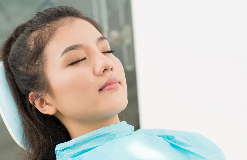Woman resting in dental chair