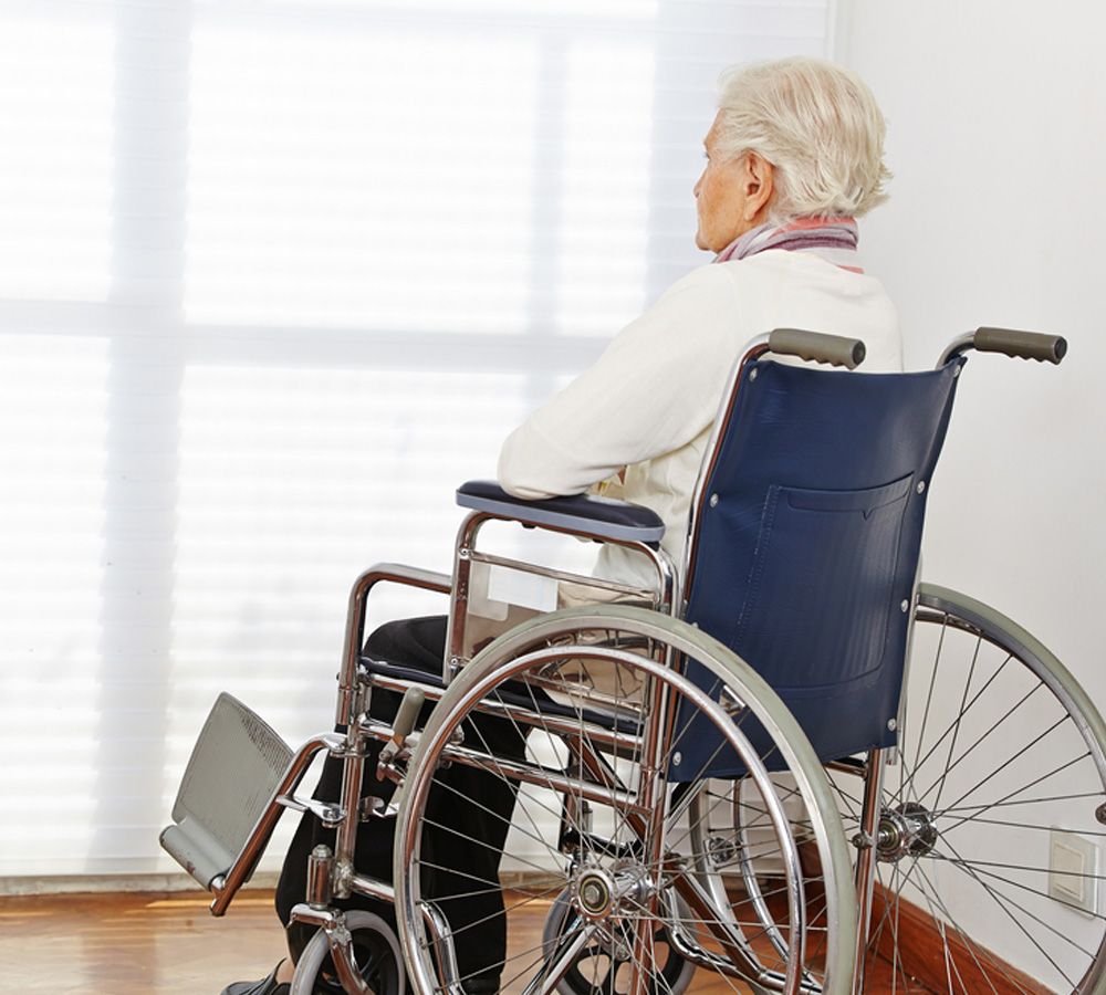 Elderly person in wheelchair