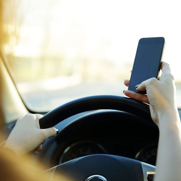 Driver texting while driving.
