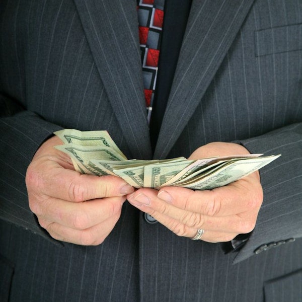 Businessman holding dollar bills