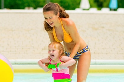 Mom playing with young daughter