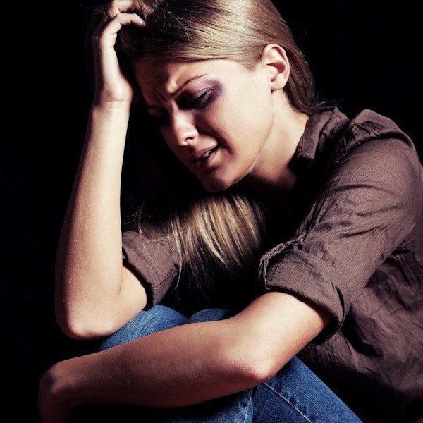 Woman crying in the dark