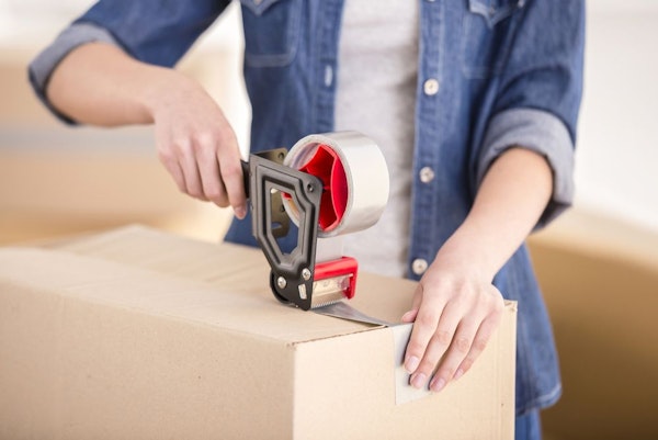 Man taping up a box