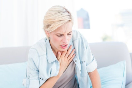 Woman feeling chest pain