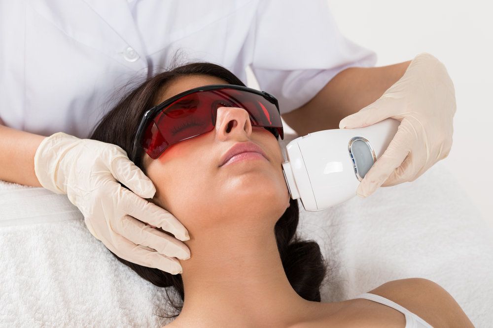 Woman receiving laser treatment