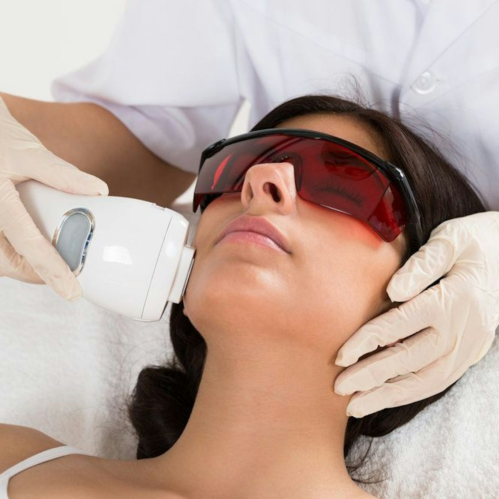 Woman receiving laser treatment