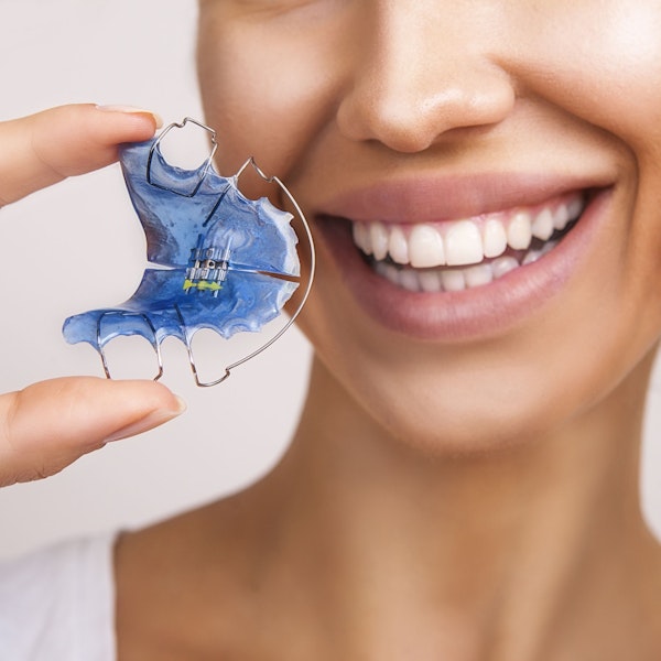 woman holding retainer