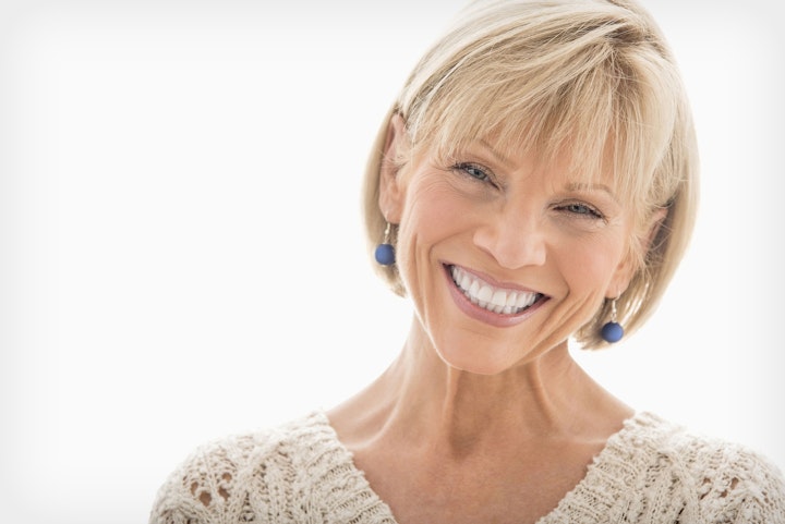 Photo of a woman smiling after a smile makeover