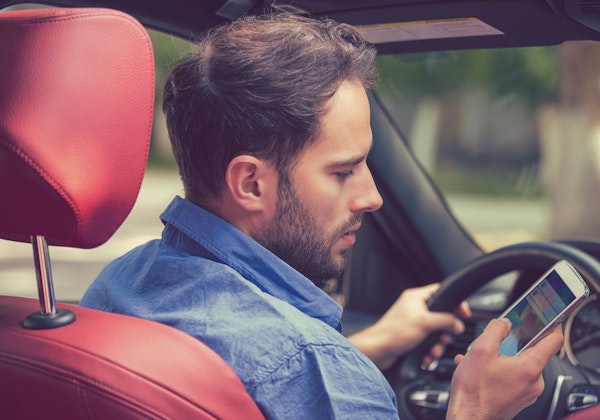 Man texting while driving