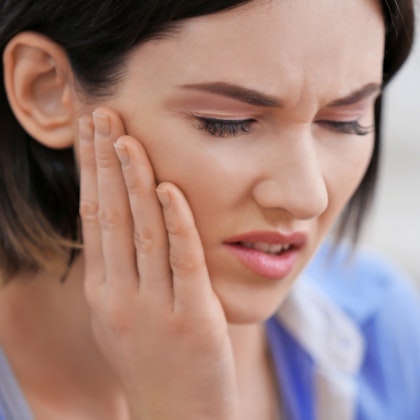 Woman with tooth pain
