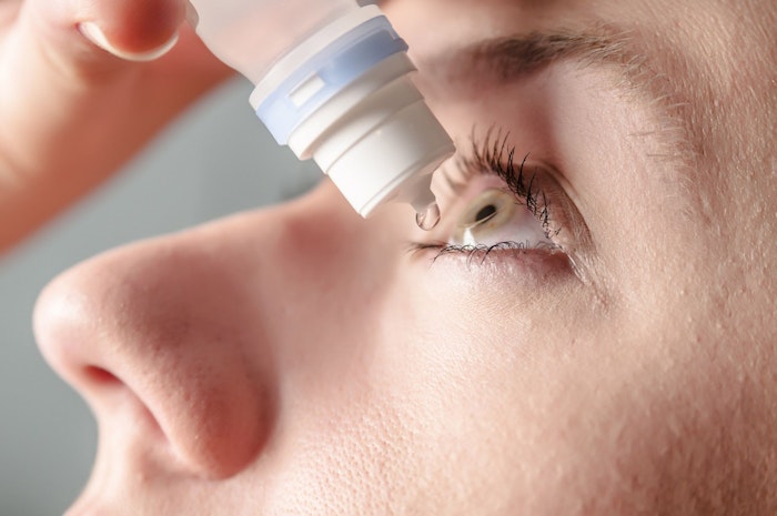 Close-up of a patient receiving eye drops