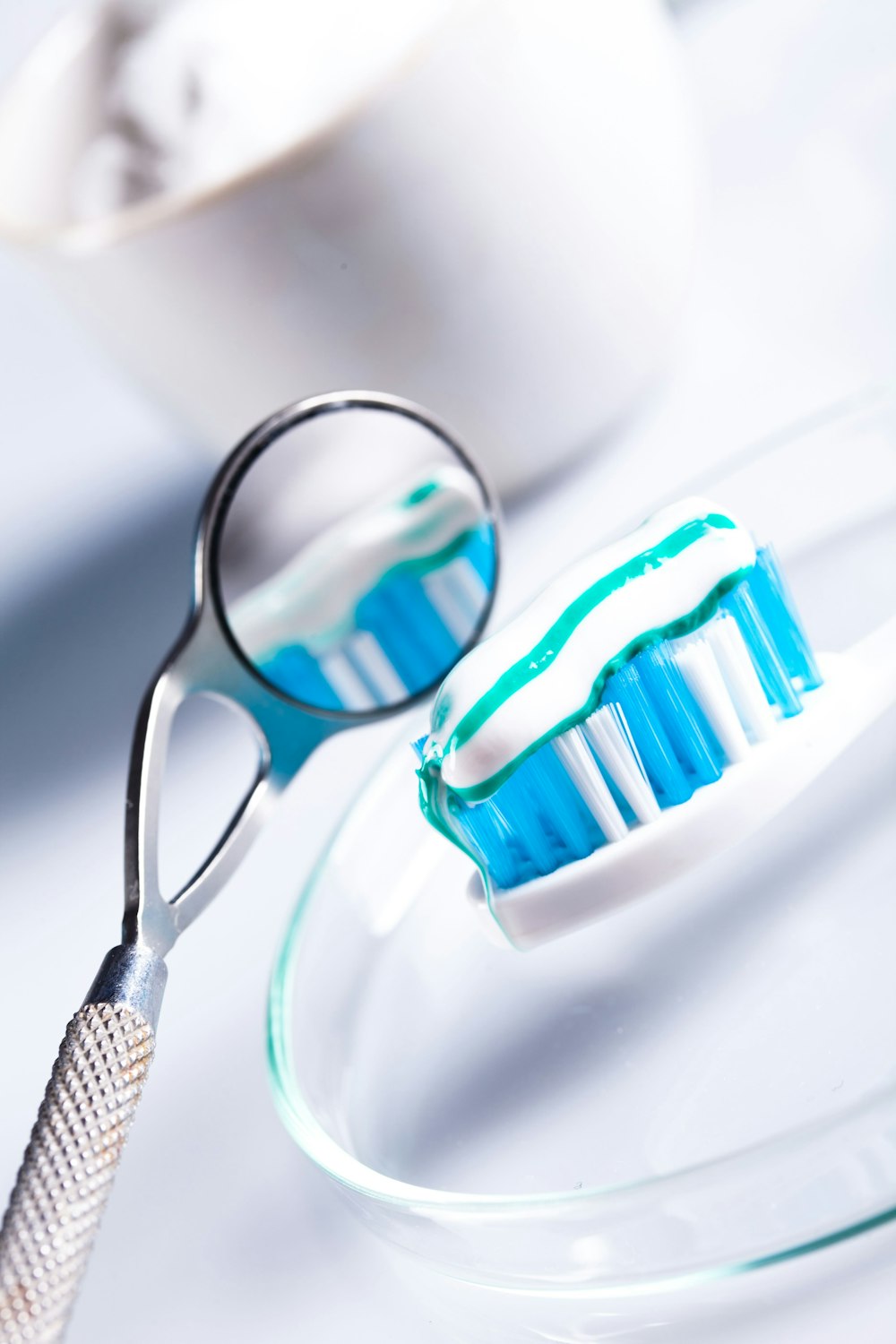 Photo of toothbrush and dental mirror