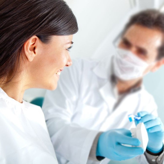 Woman talking to dentist