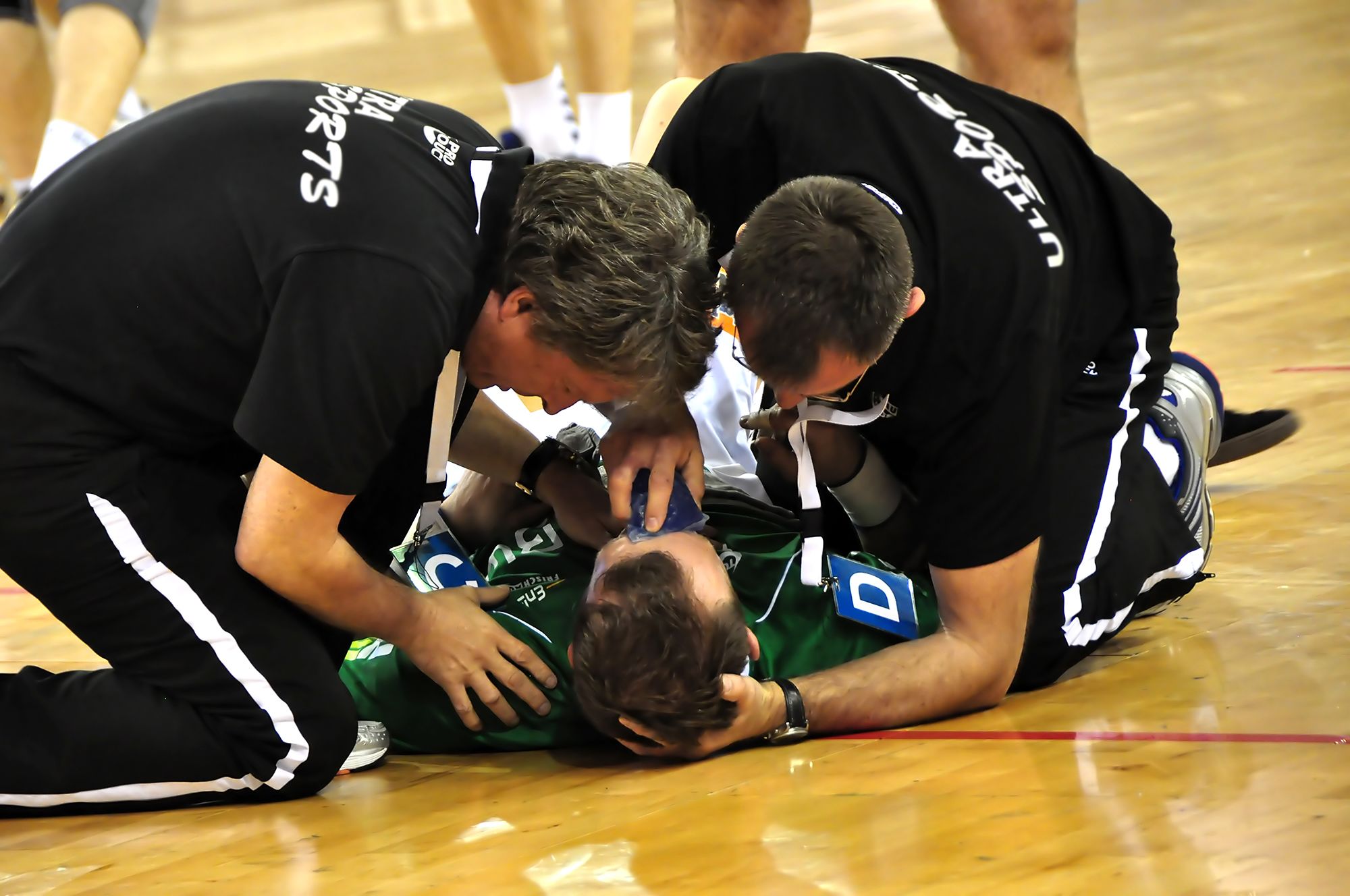 Medical specialists attending to fallen man