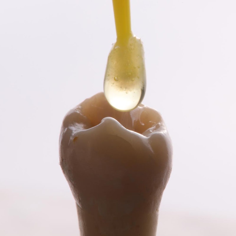 tooth getting resin for dental bonding
