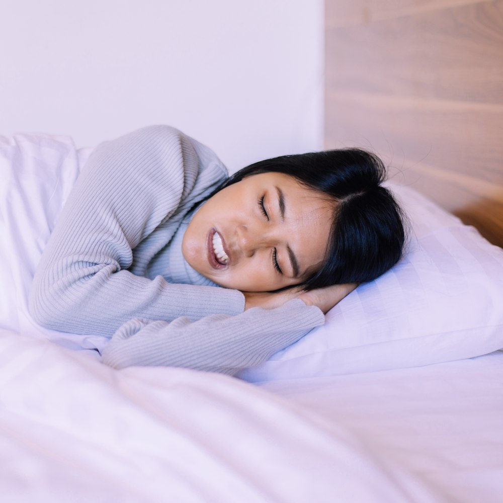 Woman grinding her teeth in her sleep