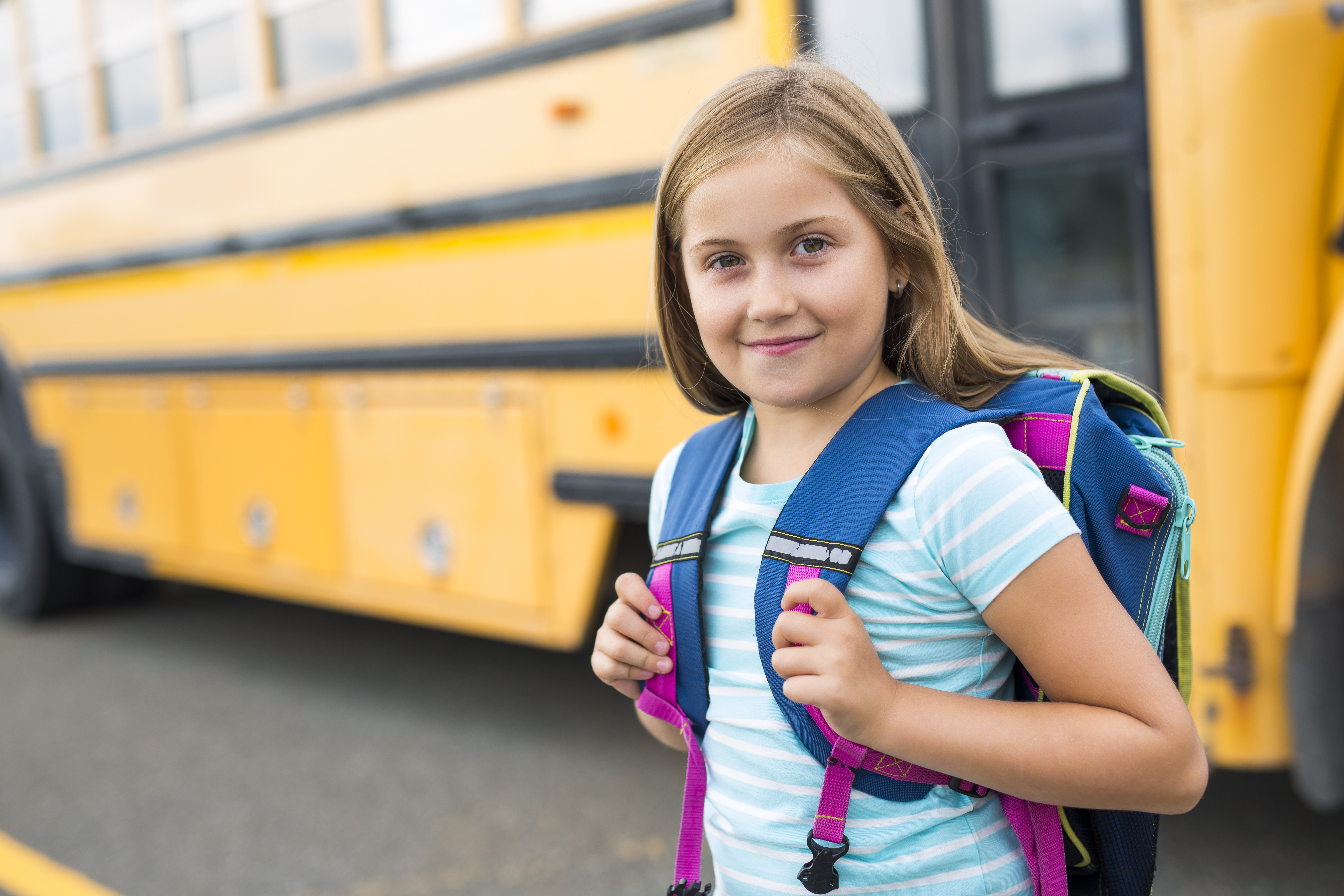 Child next to school bus
