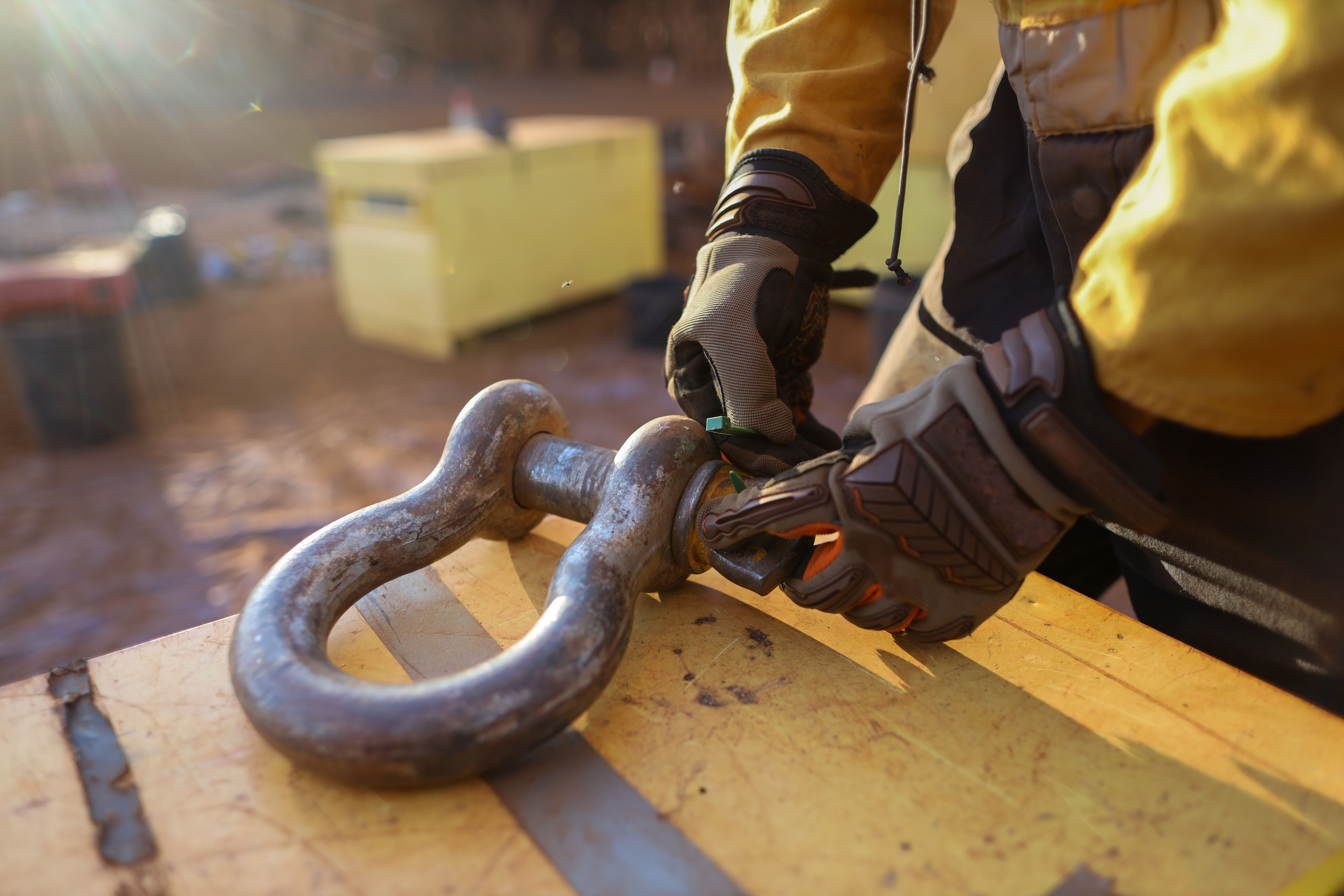 Construction worker working on heavy lock