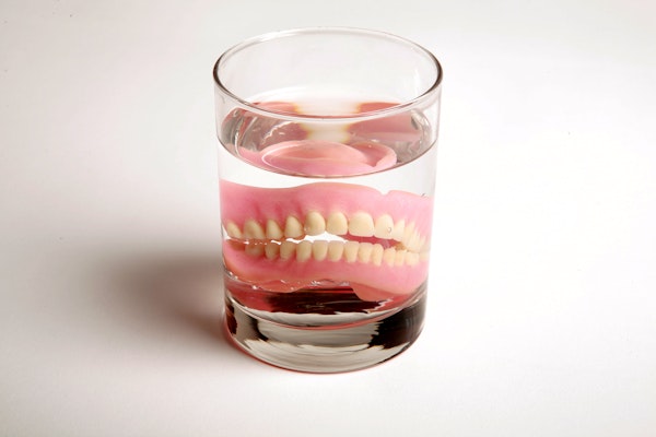 Denture in glass of water