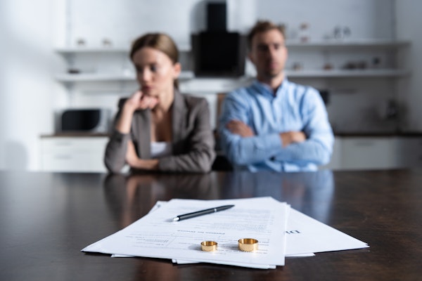 Couple with rings and paperwork
