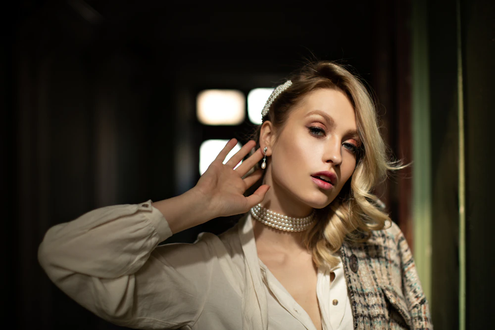woman holding ear