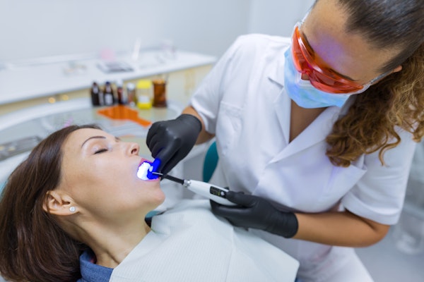 Dentist working on a patient under anesthesia