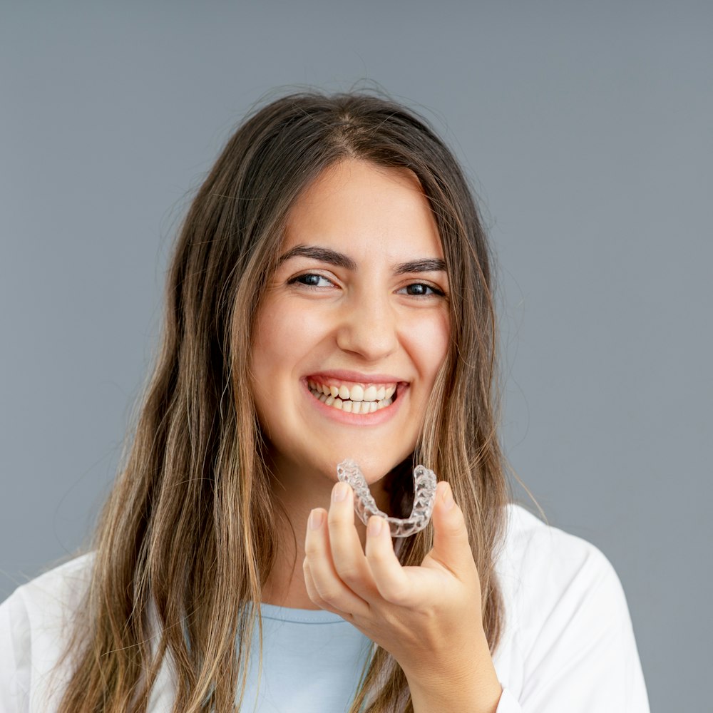 Smiling woman with invisalign