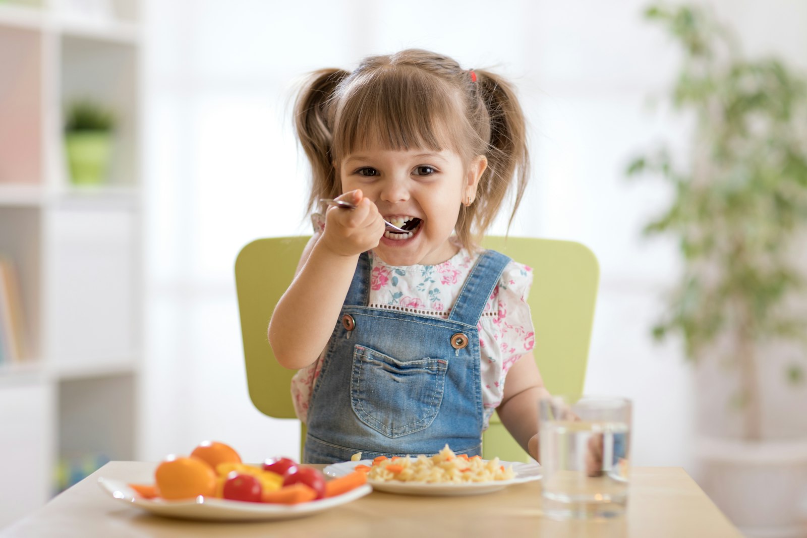 little girl eating a meal