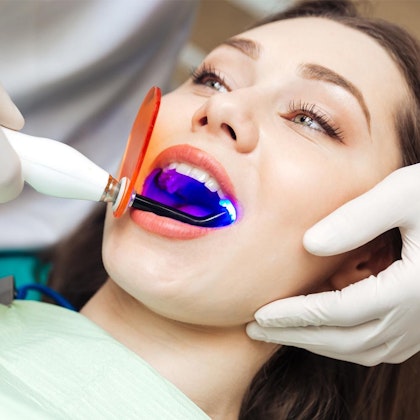 Patient getting laser gum contouring