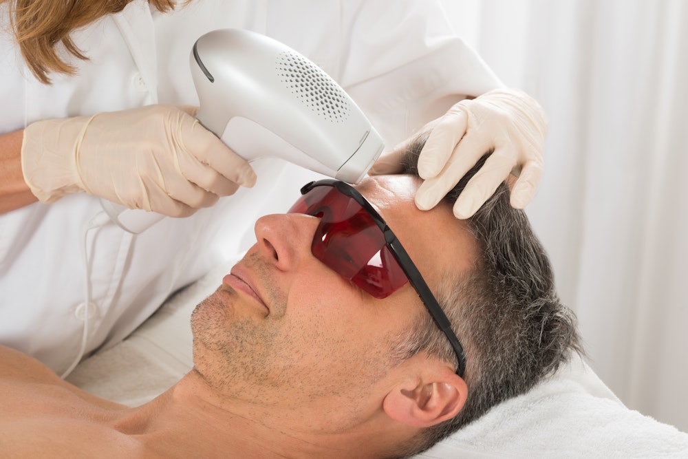 Man receiving laser therapy treatment