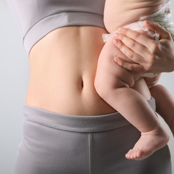 Mom's stomach while holding baby