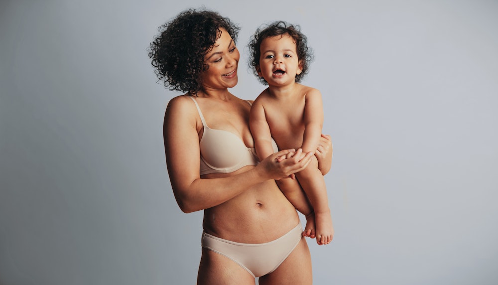 Mom holding baby in underwear