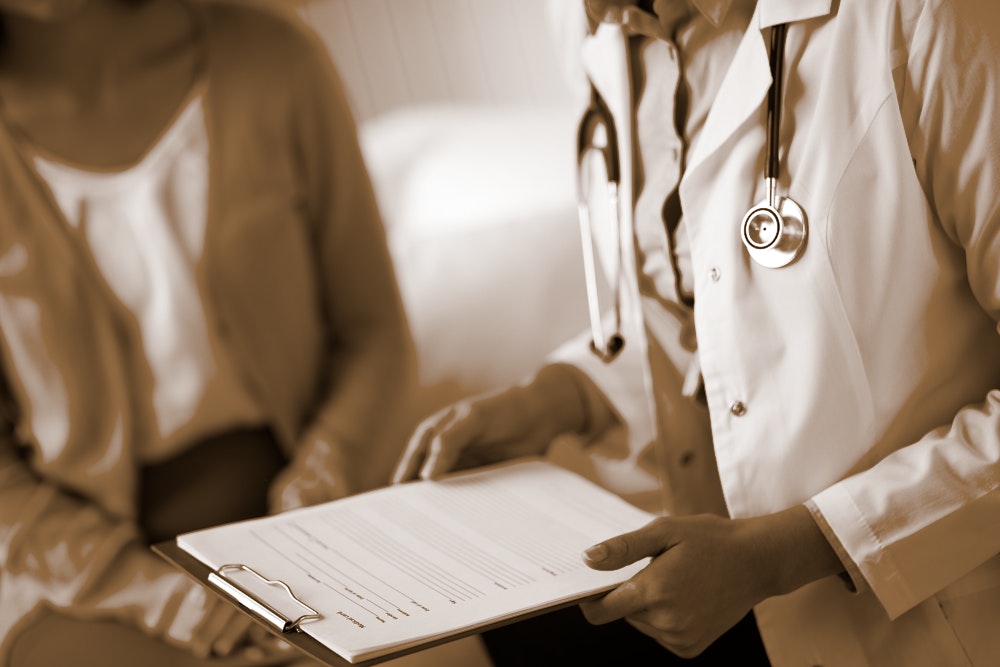 Doctor with a clipboard and Patient