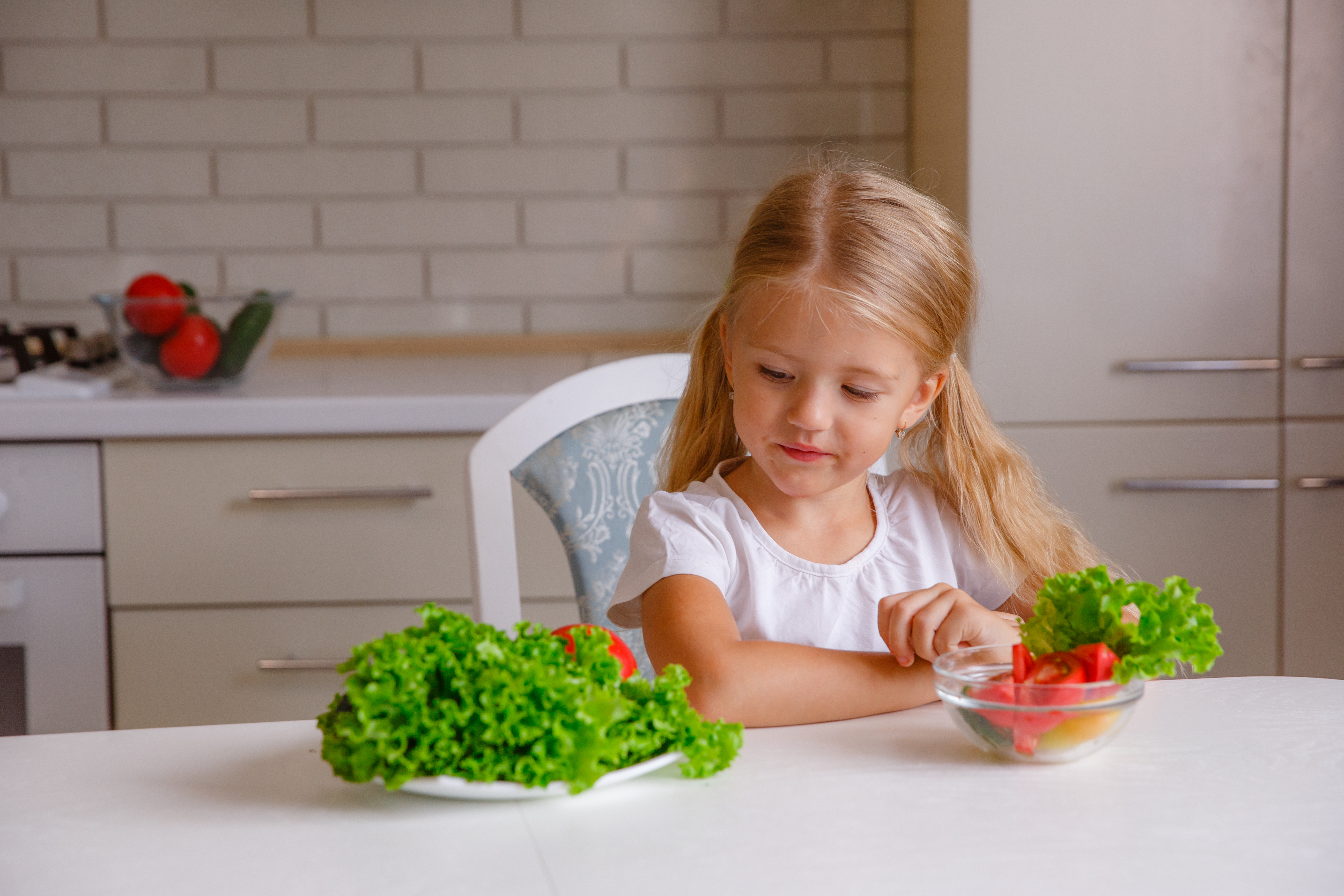 Girl frowning at vegetables