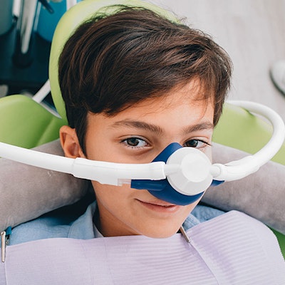 Smiling child with Nitrous Oxide