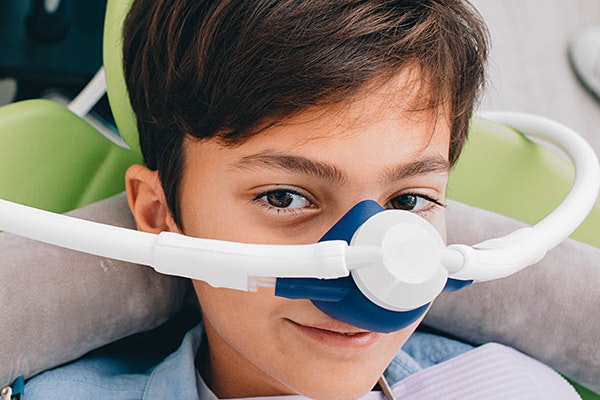 Smiling child with Nitrous Oxide