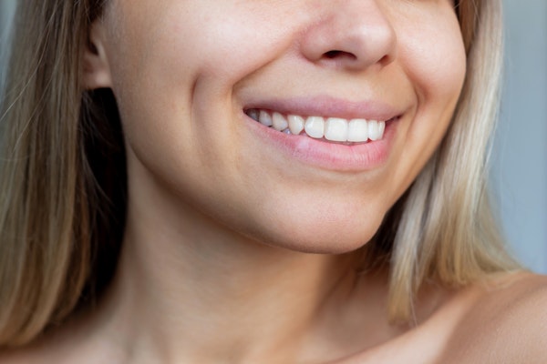 Broadly smiling woman