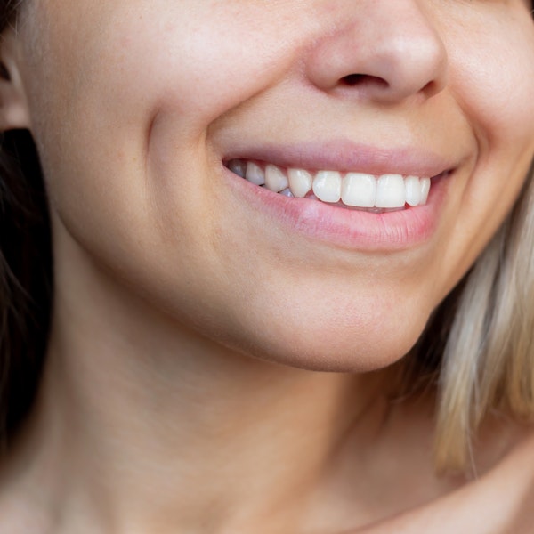 Broadly smiling woman